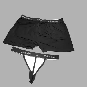 ست شورت کراواتی زن و مرد Calvin Klein کد M114K با طراحی مشکی و سفید و کراواتهای آویزی